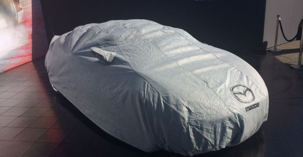 ND MX-5 under covers at Monterey on 3 September 2014. Photo by Ben Sale.